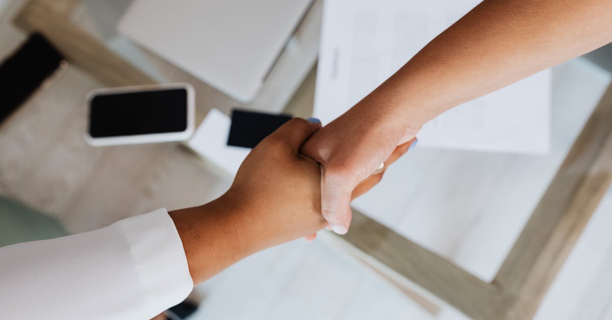 Understanding suitcases characteristics - Two People Doing A Handshake Understanding suitcases characteristics - Two People Doing A Handshake