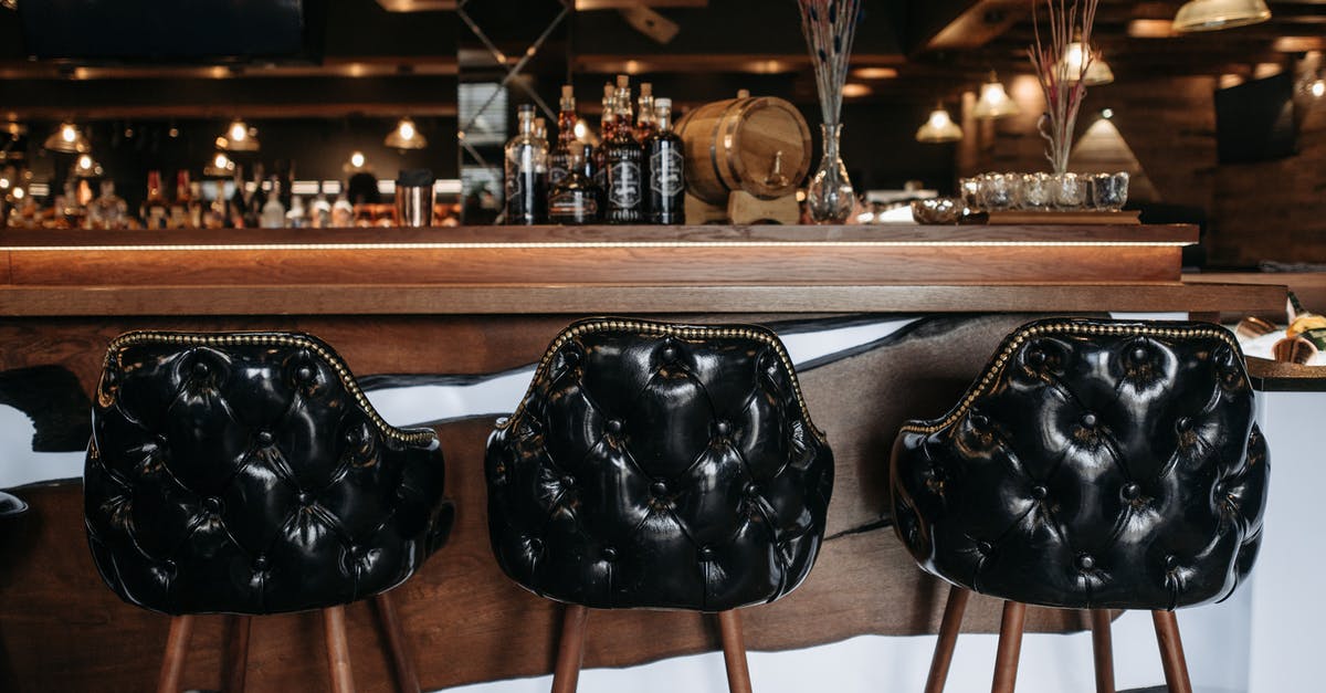 Unsafe seats on a Boeing 777? - Black Leather Handbag on Brown Wooden Bar Seat Unsafe seats on a Boeing 777? - Black Leather Handbag on Brown Wooden Bar Seat