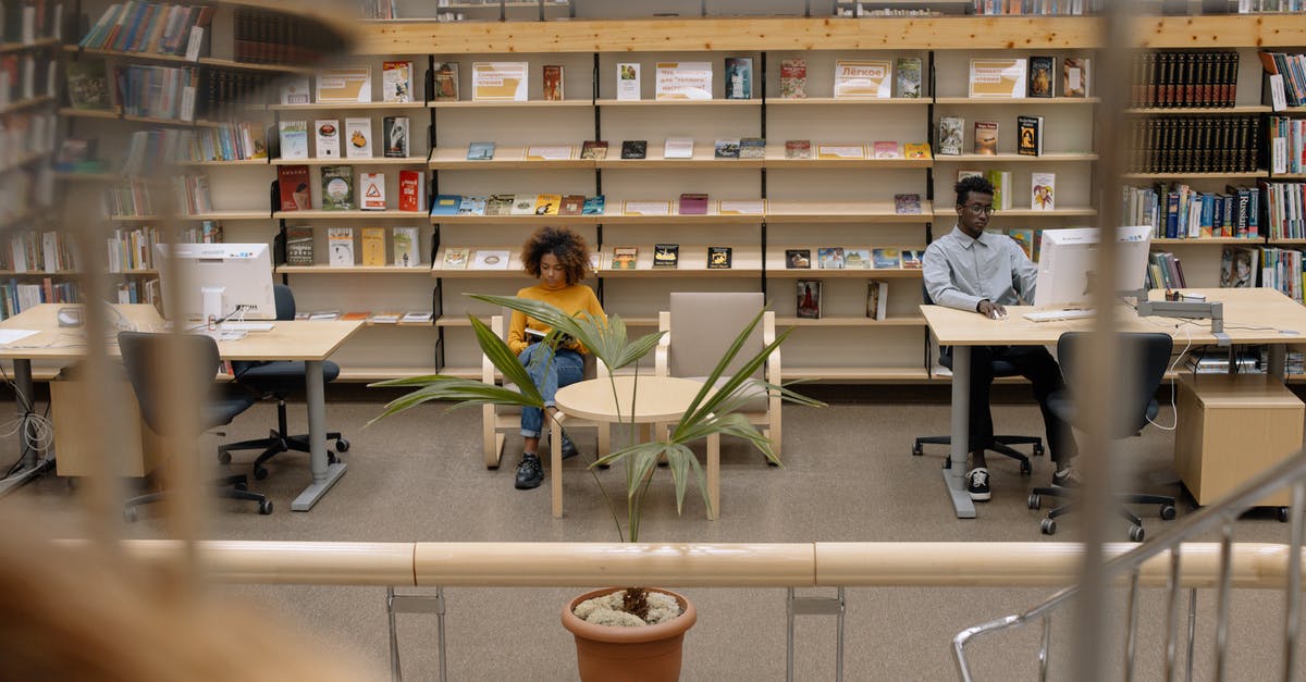*Urgent* American citizen studying in the UK. Flight leaves tomorrow, visa in processing and no biometrics? [closed] - People Sitting on Chair in Library