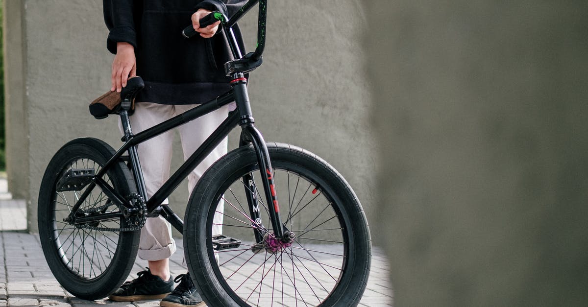 US based flights bicycle question - Person in Black Coat and Black Pants Riding Black Bicycle US based flights bicycle question - Person in Black Coat and Black Pants Riding Black Bicycle