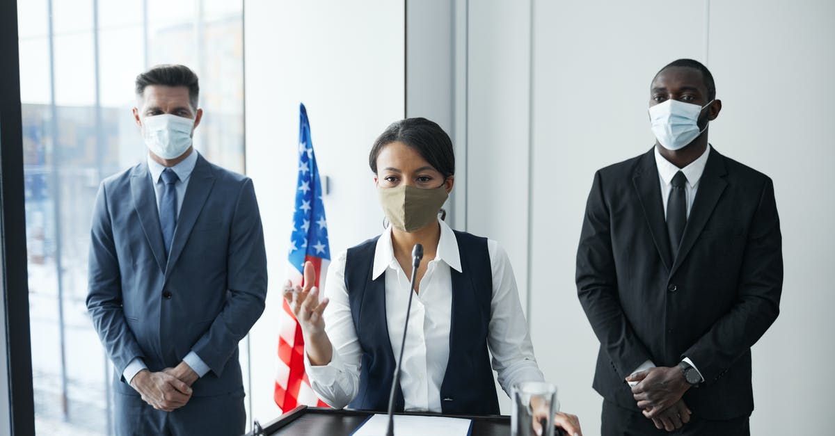 US F1 Visa grace period attending a conference - Man in Black Suit Jacket Holding Orange and White Stick US F1 Visa grace period attending a conference - Man in Black Suit Jacket Holding Orange and White Stick