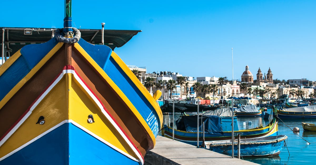 US Port of Entry: what to answer for "Are you traveling with anyone" - Boats Dock in Marsaxlokk Bay in Malta US Port of Entry: what to answer for "Are you traveling with anyone" - Boats Dock in Marsaxlokk Bay in Malta