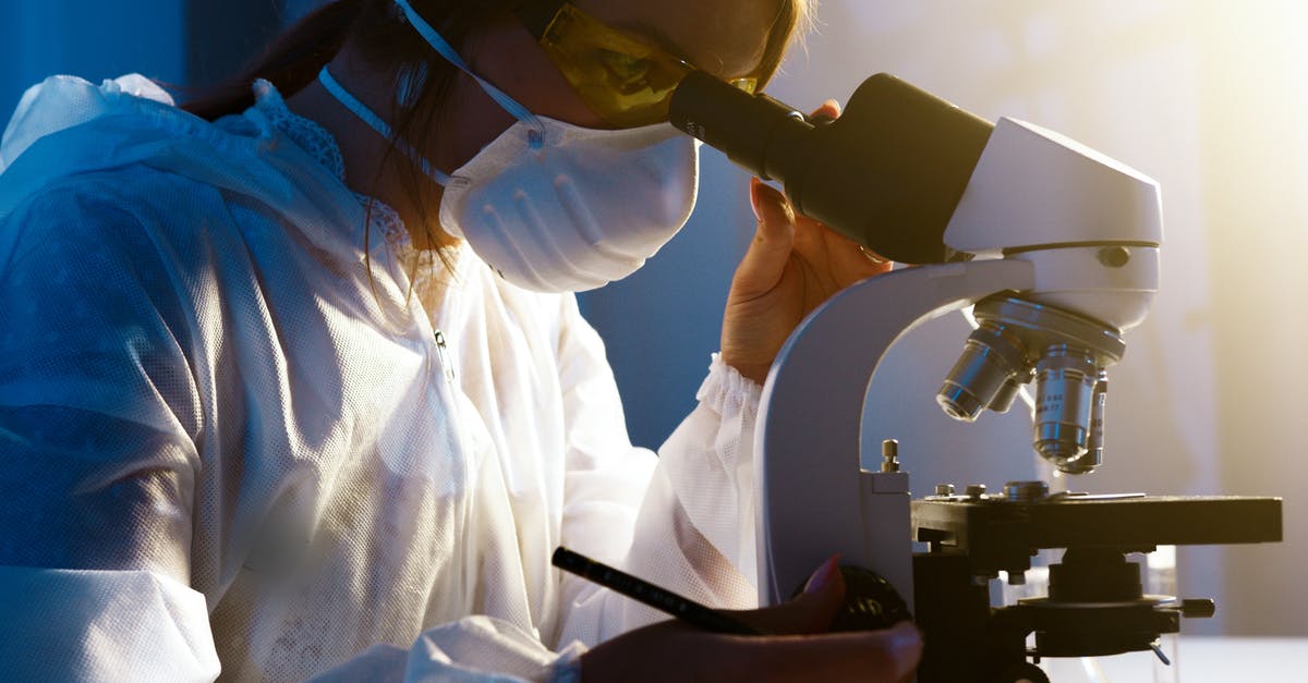 US student participating in science research in the UK. What visa do I need? - Photo Of Woman Looking Through Camera US student participating in science research in the UK. What visa do I need? - Photo Of Woman Looking Through Camera