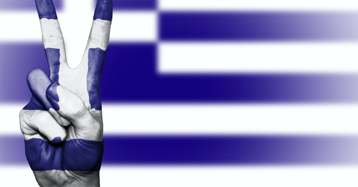 US to Greece during Covid-19 - Person's Right Hand With Blue and White Paint US to Greece during Covid-19 - Person's Right Hand With Blue and White Paint