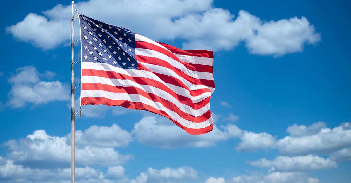 US visa process from outside India for Indian citizen - USA flag on blue sky US visa process from outside India for Indian citizen - USA flag on blue sky