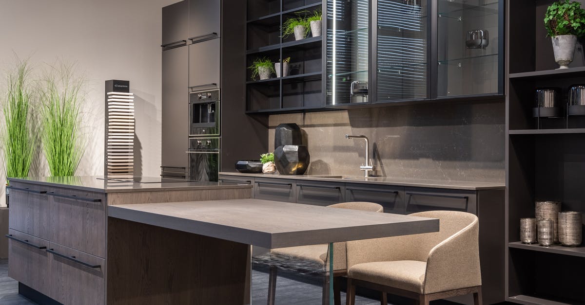 USA: cellular plans with domestic roaming - Modern trendy kitchen interior with dark cabinets and counter in spacious contemporary flat USA: cellular plans with domestic roaming - Modern trendy kitchen interior with dark cabinets and counter in spacious contemporary flat