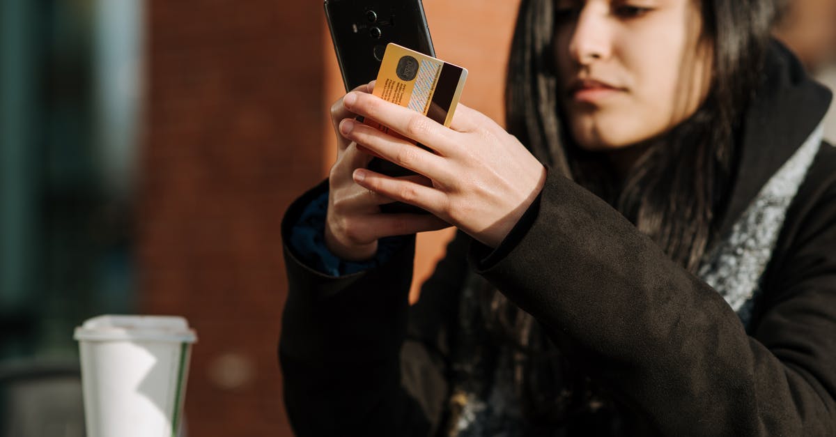 Used a debit card to book on booking.com for a hotel for six months that I thought had free cancellations [closed] - Crop young Hispanic female shopper with debit card making purchase on cellphone near takeaway beverage in cafeteria