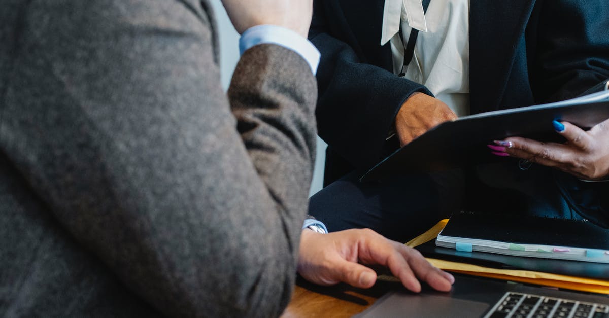 Using affidavit to show Proof of ties for Visa application, Real Estate Document - Crop faceless ethnic female entrepreneur in classy suit showing document to anonymous male boss sitting at table with laptop Using affidavit to show Proof of ties for Visa application, Real Estate Document - Crop faceless ethnic female entrepreneur in classy suit showing document to anonymous male boss sitting at table with laptop
