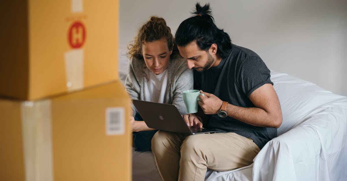 Using affidavit to show Proof of ties for Visa application, Real Estate Document - Young multiethnic couple watching laptop while moving house Using affidavit to show Proof of ties for Visa application, Real Estate Document - Young multiethnic couple watching laptop while moving house