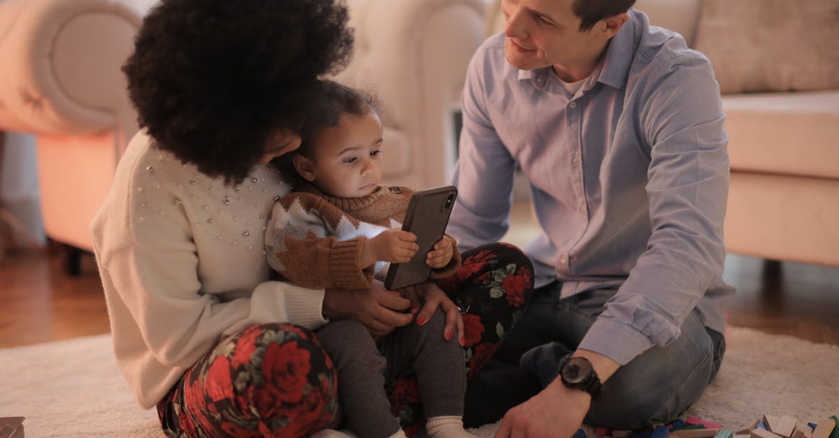 Using no-show ticket for infant - Man and Woman Having Fun With Their Child Using no-show ticket for infant - Man and Woman Having Fun With Their Child