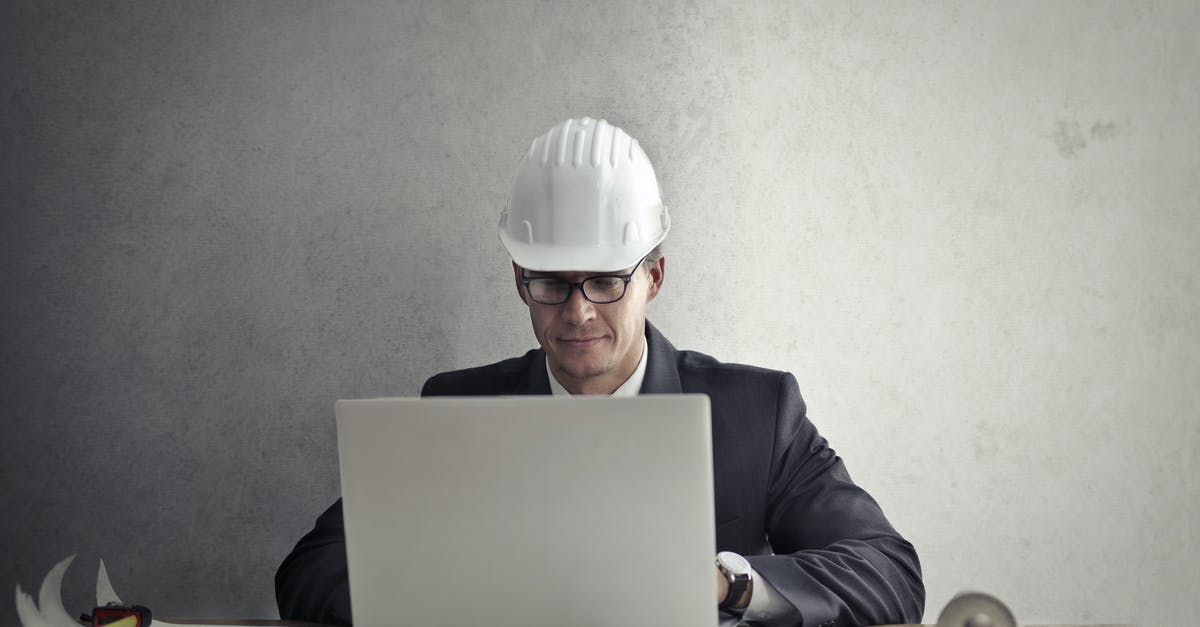 Using the IndRail pass for a good Indian experience - Engineer working with laptop at table Using the IndRail pass for a good Indian experience - Engineer working with laptop at table
