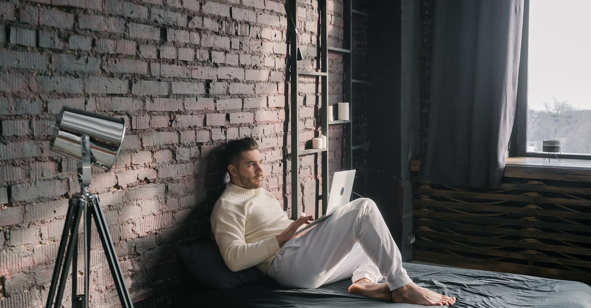 Using tickets from Vienna to Budapest - Man in White Dress Shirt Lying on Bed Using tickets from Vienna to Budapest - Man in White Dress Shirt Lying on Bed