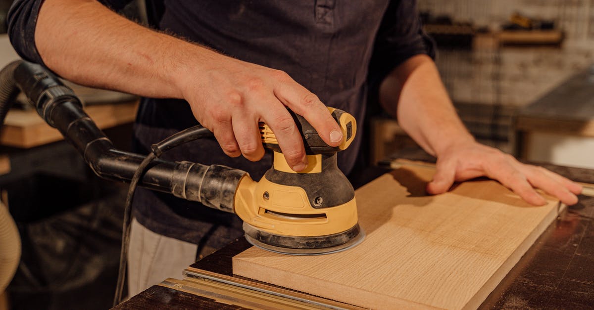Valencia: Places to work temporarily [closed] - Man in Black T-shirt Holding Black and Yellow Cordless Power Drill