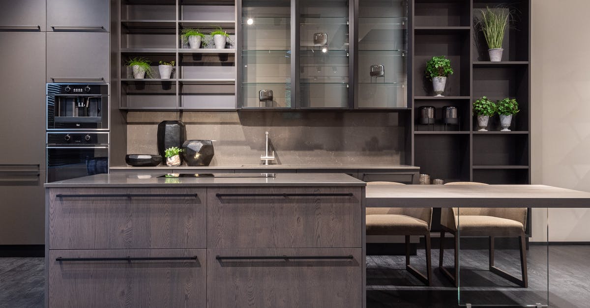Valid USA Visa Barcode Corner Cut - Contemporary kitchen interior design with empty dark furniture and decorative vases and plants Valid USA Visa Barcode Corner Cut - Contemporary kitchen interior design with empty dark furniture and decorative vases and plants