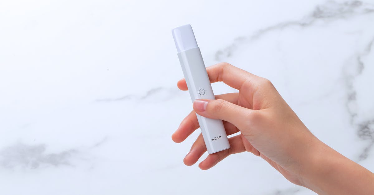 Vape cartridge scrutiny at UK customs - Person Holding White Electronic Device