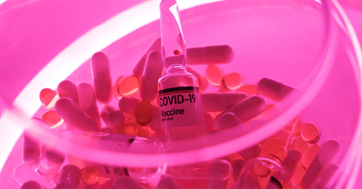 Various covid certificates for vaccinations done in Canada - Glass bowl with capsules and vaccine for coronavirus Various covid certificates for vaccinations done in Canada - Glass bowl with capsules and vaccine for coronavirus