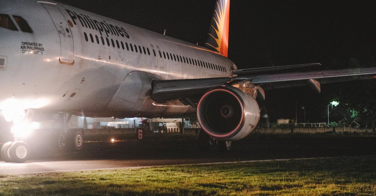 VAT refund at Luton airport - White and Red Airplane on the Airport during Night Time VAT refund at Luton airport - White and Red Airplane on the Airport during Night Time