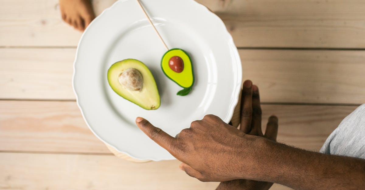 Vietnam e-visa: exit Point differing from entry Point - Top view of crop anonymous African American man pointing on organic healthy avocado helping child to choose between natural fruit and sweet lollipop Vietnam e-visa: exit Point differing from entry Point - Top view of crop anonymous African American man pointing on organic healthy avocado helping child to choose between natural fruit and sweet lollipop