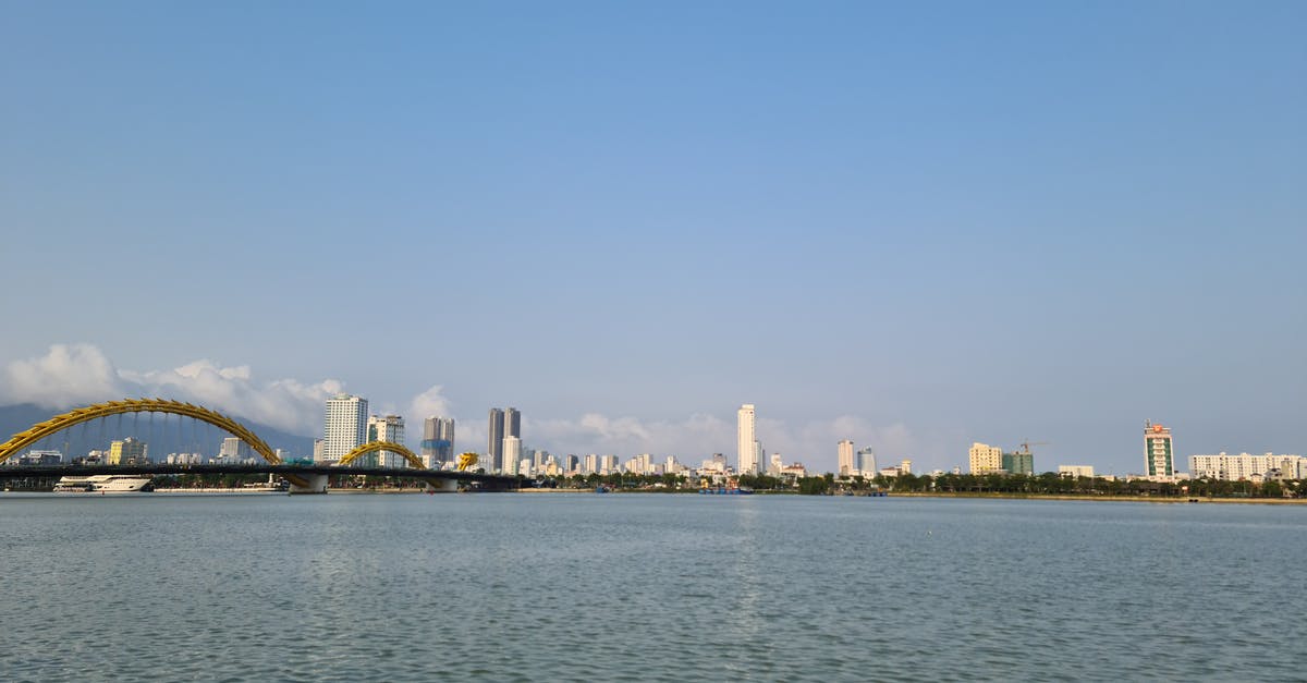 Vietnam visa for UK citizen - City Skyline Across Body of Water Vietnam visa for UK citizen - City Skyline Across Body of Water