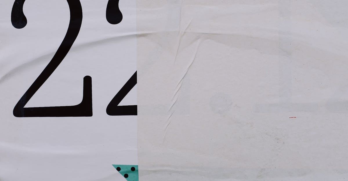 Visa label with alphanumeric number at back of passport, what does it mean? [closed] - Half of poster on wall in city