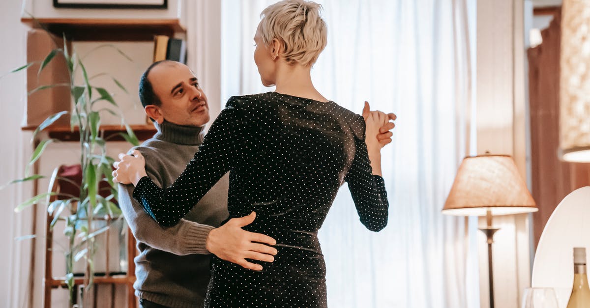 Visa needed for the wife of a British citizen to live together in Spain [closed] - Couple dancing together in living room