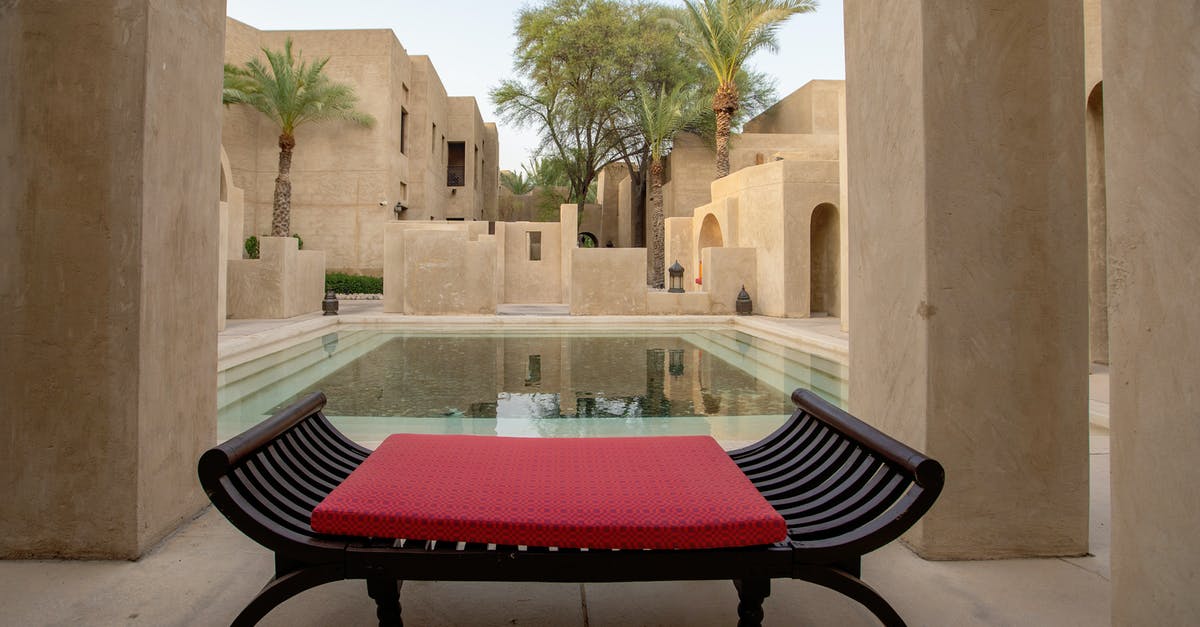 Visa on arrival in UAE for Chinese - Wooden Bench Near a Swimming Pool Visa on arrival in UAE for Chinese - Wooden Bench Near a Swimming Pool