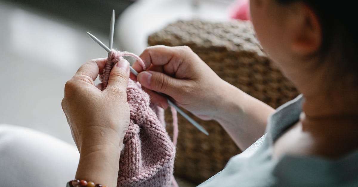 Visa refused in Admin Process but passports are in hold - Crop faceless female holding needles and knitting pink cloth while sitting at home Visa refused in Admin Process but passports are in hold - Crop faceless female holding needles and knitting pink cloth while sitting at home