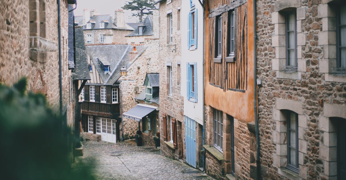 Visa requirement for two visits to Europe (Switzerland and Germany) 80 days apart - Narrow cobblestone street with attached old brick and stone buildings in historic town on cloudy day Visa requirement for two visits to Europe (Switzerland and Germany) 80 days apart - Narrow cobblestone street with attached old brick and stone buildings in historic town on cloudy day