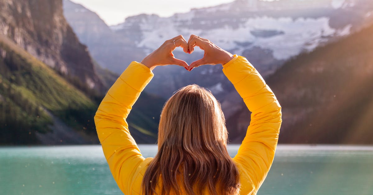 Visa requirements for a 2-week holiday to Canada - Back View Of Woman in Yellow Long Sleeve Shirt With Heart Hand Gesture Visa requirements for a 2-week holiday to Canada - Back View Of Woman in Yellow Long Sleeve Shirt With Heart Hand Gesture