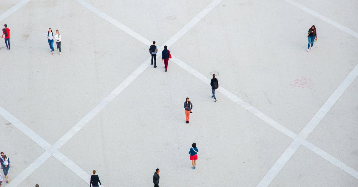 Visa Requirements for Belarus for EU citizen - High angle citizens in casual wear walking on vast concrete ground in city square Visa Requirements for Belarus for EU citizen - High angle citizens in casual wear walking on vast concrete ground in city square