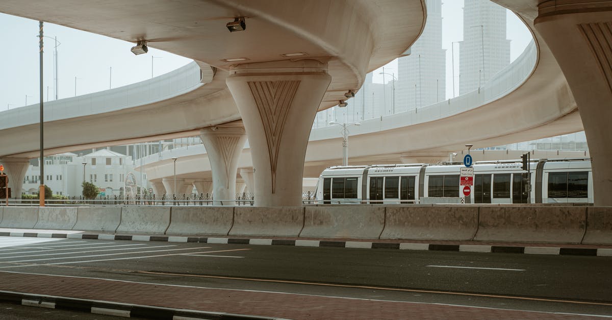 Visa requirements for Dubai airport - White and Black Train in a Train Station