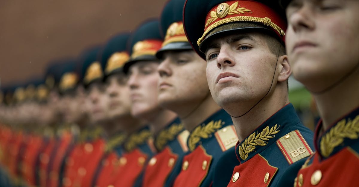 Visa requirements to Croatia for Russian citizens - Men in Black and Red Cade Hats and Military Uniform
