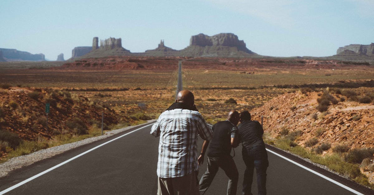 Visa-free Travel Route on a Pakistani Passport - Unrecognizable black men on asphalt road Visa-free Travel Route on a Pakistani Passport - Unrecognizable black men on asphalt road