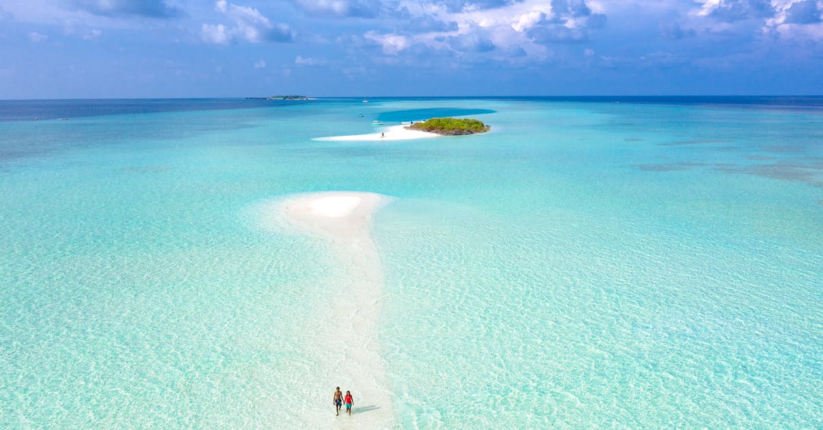 Visa/permit for foreign tourists to visit the Andaman Islands? - Aerial Photography of Two Person Walking on Seashore Visa/permit for foreign tourists to visit the Andaman Islands? - Aerial Photography of Two Person Walking on Seashore