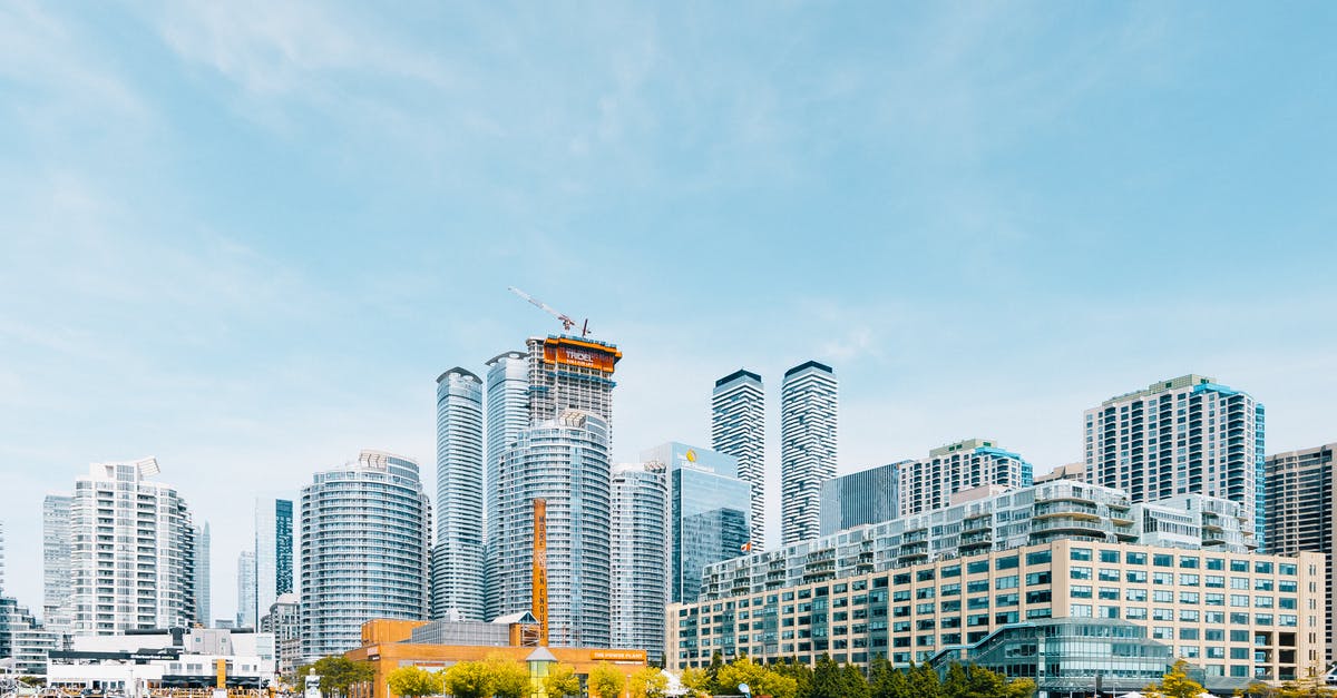 Visiting Canada for a job interview: tourism or business? eTA or visa? - White High Rise Buildings Near Body of Water