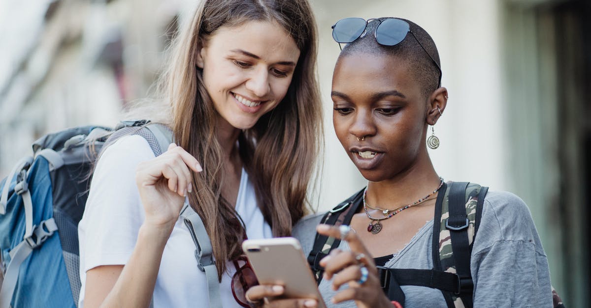 Visiting Costa Rica: How to prove sufficient funds? - Women Travelers Visiting City with Backpacks Using Smart Phone Visiting Costa Rica: How to prove sufficient funds? - Women Travelers Visiting City with Backpacks Using Smart Phone