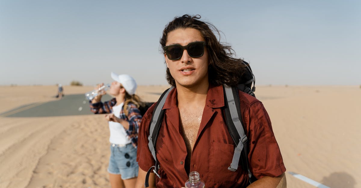Visiting Dubai as an unmarried couple [duplicate] - A Man and A Woman Standing on Desert