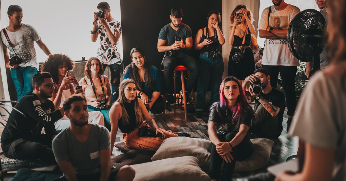 Visiting the Edinburgh Fringe (events information) - Group of multiethnic young people wearing casual clothes gathering together in spacious studio and listening attentively to female speaker Visiting the Edinburgh Fringe (events information) - Group of multiethnic young people wearing casual clothes gathering together in spacious studio and listening attentively to female speaker