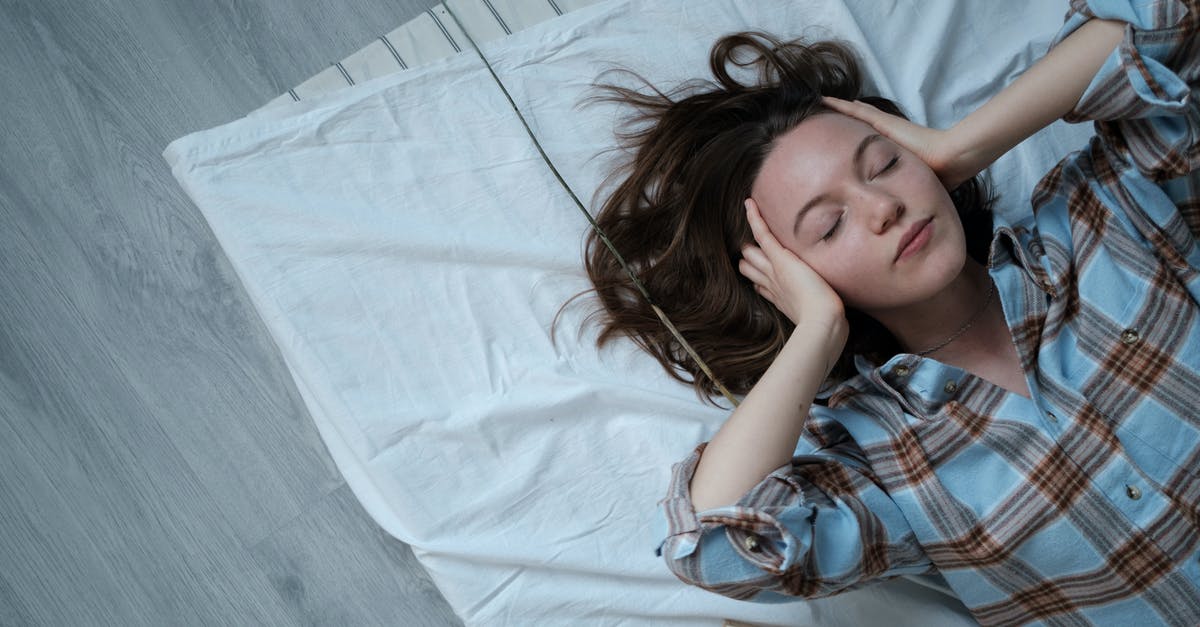 Vladivostok customs clearance for Eastern Dream - Girl in Blue White and Red Plaid Shirt Lying on Bed Vladivostok customs clearance for Eastern Dream - Girl in Blue White and Red Plaid Shirt Lying on Bed