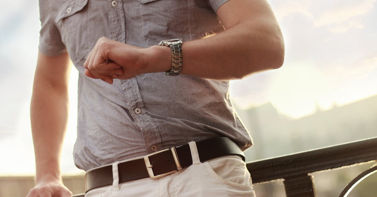 Waiting time when applying for a German passport abroad? - Man Showing Wristwatch Waiting time when applying for a German passport abroad? - Man Showing Wristwatch