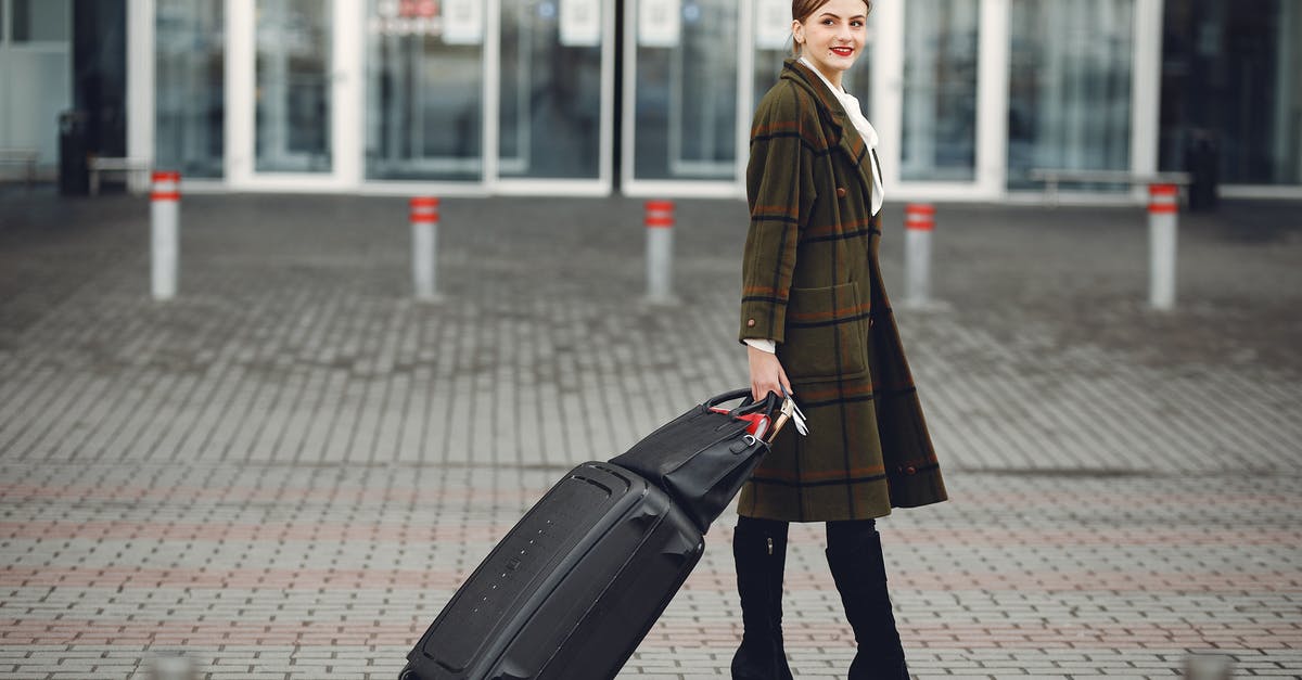 Walking away from my connecting flight on a domestic [US] return journey. What are the consequences? [duplicate] - Full length of smiling female manager in stylish coat walking with suitcase and bag while traveling on business trip smiling away