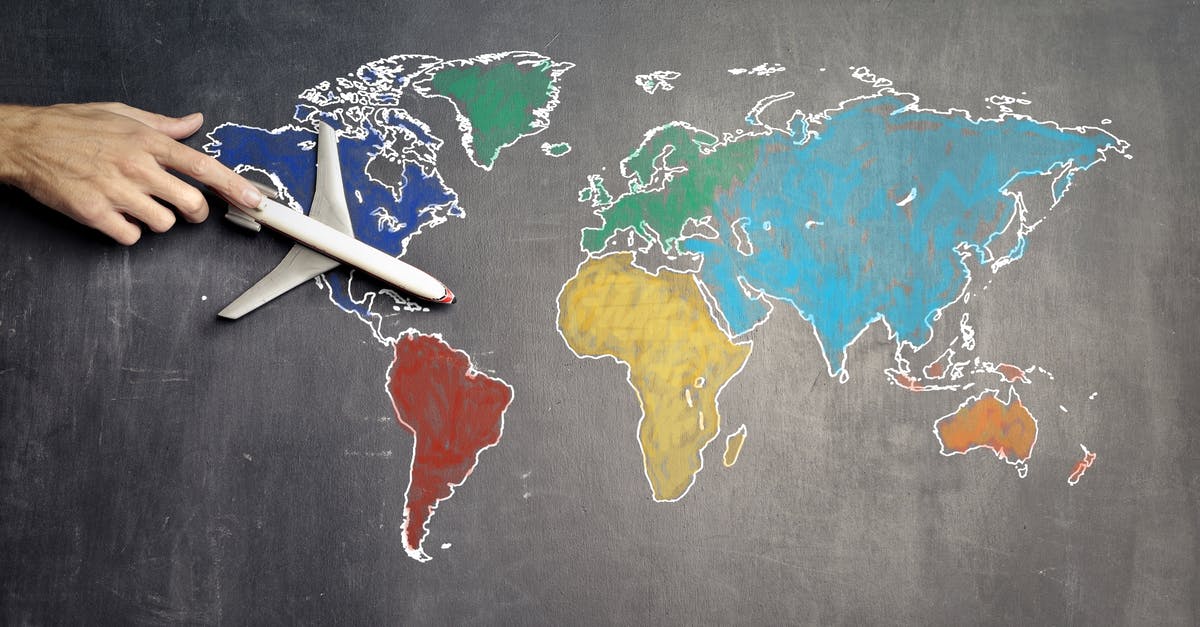 Walking away from my connecting flight on a domestic [US] return journey. What are the consequences? [duplicate] - Top view of crop anonymous person holding toy airplane on colorful world map drawn on chalkboard