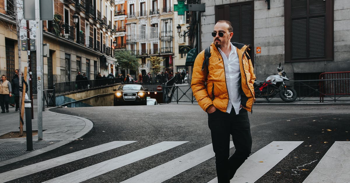 Walking on a road in Spain - Photo of Man Walking on Pedestrian Crossing Walking on a road in Spain - Photo of Man Walking on Pedestrian Crossing