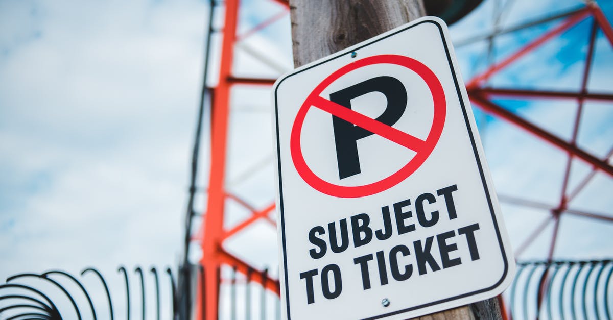 Warning about needing "authorization" when booking ticket - A No Parking Sign on a Wooden Post Warning about needing "authorization" when booking ticket - A No Parking Sign on a Wooden Post