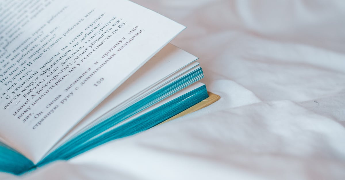 Water damaged passport with all the data pages perfectly alright [closed] - Photo of a Book on White Textile