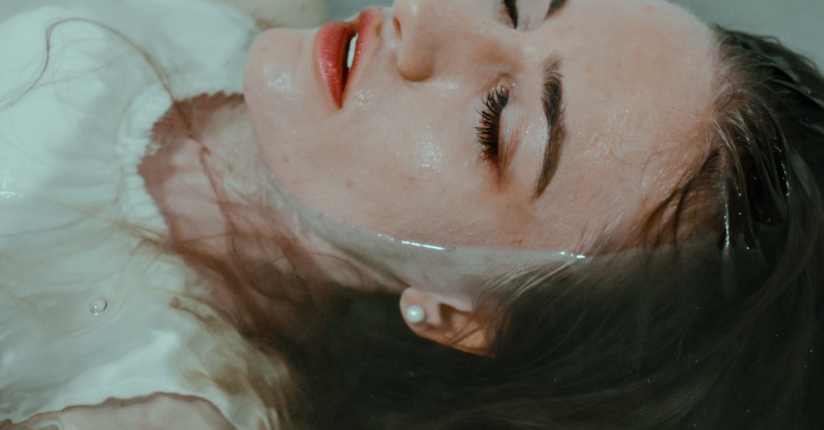 Water Smudge Marks on Passport_ Can it be Considered as 'Damaged'? [closed] - Woman resting in bathtub with eyes closed