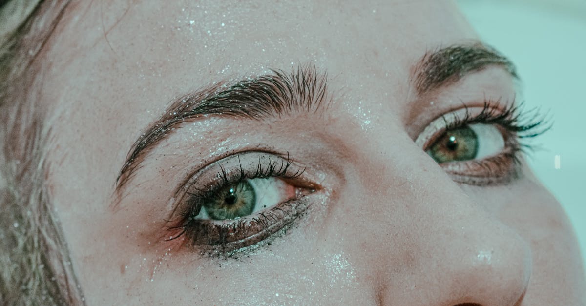 Water Smudge Marks on Passport_ Can it be Considered as 'Damaged'? [closed] - Closeup of anonymous female with wet face and mascara under eyes looking at camera while lying in bathtub