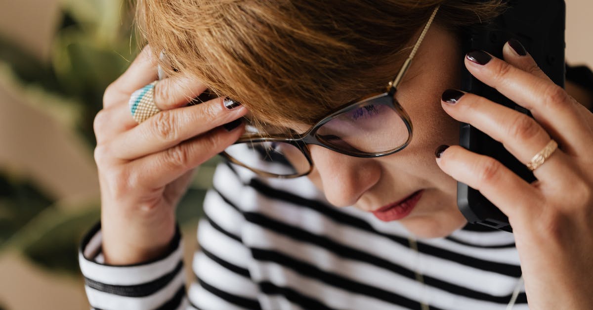 We're all adults here - how to use a squat toilet if you have trouble squatting? - Anxious woman having phone conversation in office We're all adults here - how to use a squat toilet if you have trouble squatting? - Anxious woman having phone conversation in office