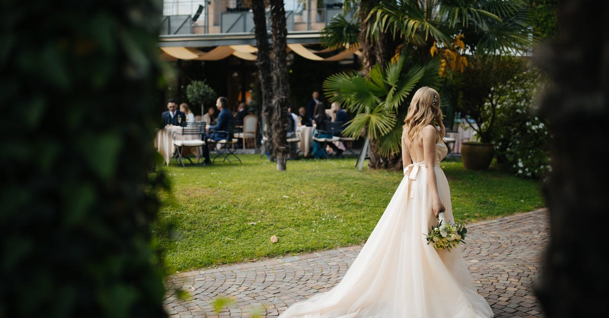 Website for budget hotels or hostels for Switzerland - Woman Wearing Wedding Dress and Holding a Bouquet of Flowers Standing on Brick Pathway Website for budget hotels or hostels for Switzerland - Woman Wearing Wedding Dress and Holding a Bouquet of Flowers Standing on Brick Pathway