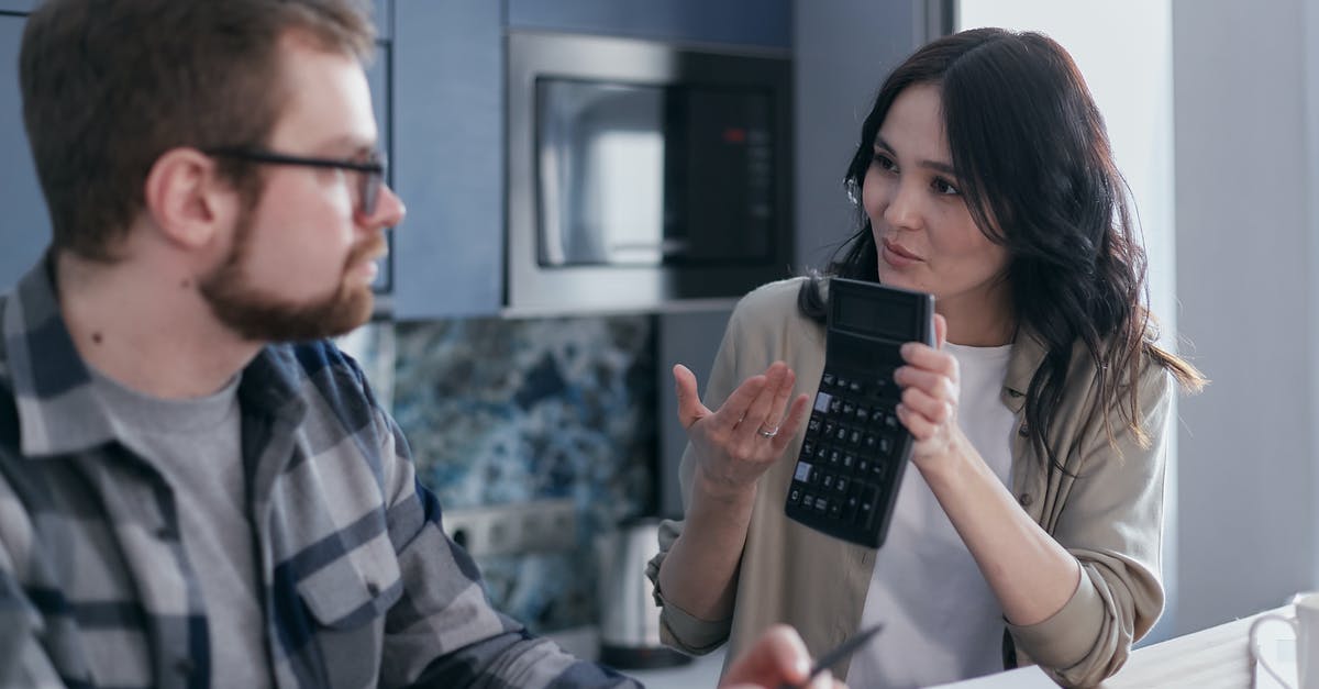 Website for budget hotels or hostels for Switzerland - Man in Black and White Plaid Dress Shirt Holding Black Smartphone Website for budget hotels or hostels for Switzerland - Man in Black and White Plaid Dress Shirt Holding Black Smartphone